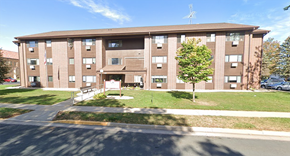 Chatfield apartment for rent - apartment building with grass and trees