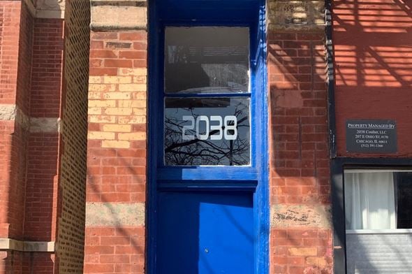 Chicago apartment for rent - A blue door with the number 2038 on it.