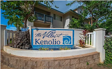Kihei apartment for rent - A sign for The Villas at Kenolio in front of a building.