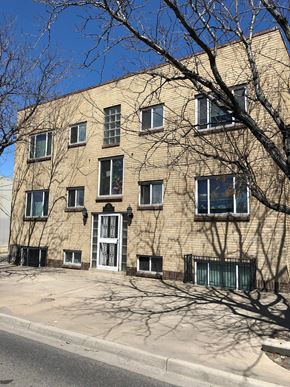 Denver apartment for rent - A building with a tree in front of it.