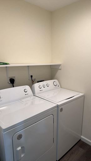 Pocomoke City house for rent - Two white front loading washing machines in a laundry room.