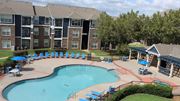 Oklahoma City apartment for rent - A kitchen area with a dishwasher and a refrigerator.