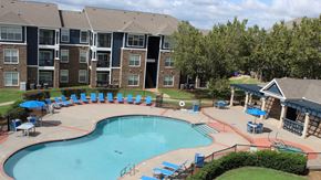 Oklahoma City apartment for rent - A kitchen area with a dishwasher and a refrigerator.