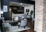Oklahoma City apartment for rent - A well-equipped home gym with wooden flooring and white walls.