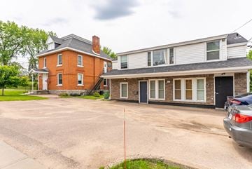 Pembroke apartment for rent - A red brick house with a white house attached to it.