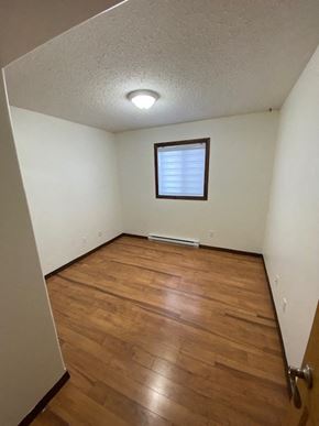 Brandon apartment for rent - A room with wooden floors and a window.