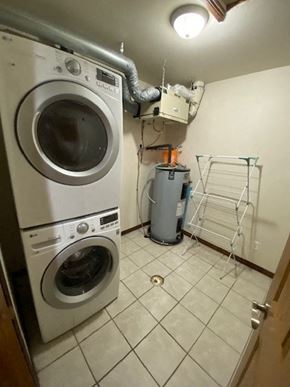 Brandon apartment for rent - A white dryer and washer are in a small laundry room.