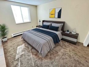 Denver apartment for rent - A parking garage with a stone wall on the left side.
