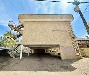 Denver apartment for rent - A parking garage with cars parked in it.