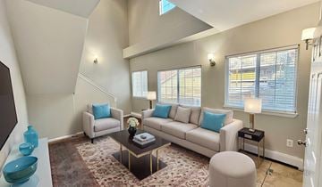 Golden apartment for rent - A living room with a couch, chairs, and a coffee table.