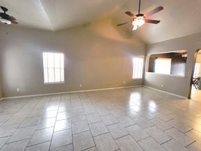 Killeen house for rent - A room with a ceiling fan and tile flooring.