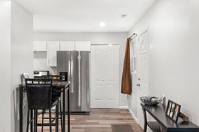 Gary house for rent - A kitchen with a table and chairs.