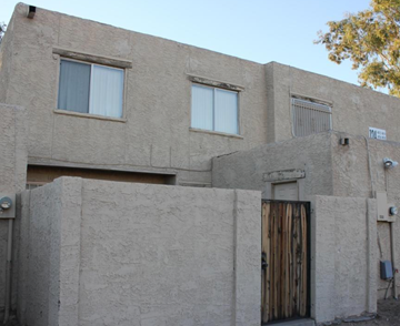 Phoenix apartment for rent - A building with a wooden door and windows.