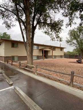 Fountain apartment for rent - A house with a brown roof and a brown fence.
