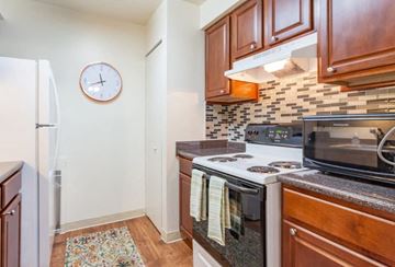 Westland apartment for rent - A kitchen with a stove top oven and a microwave.