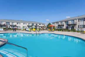 Westland apartment for rent - A large swimming pool in front of apartment buildings.
