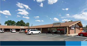 Colorado Springs apartment for rent - A State Farm office with a parking lot in front.