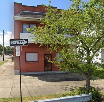 Cleveland apartment for rent - A red brick building with a tree in front of it.
