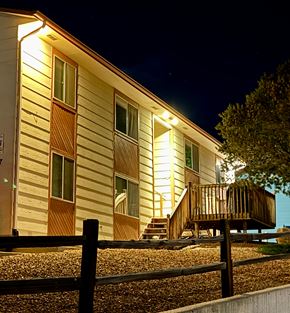 Colorado Springs apartment for rent - A house with lights on at night.