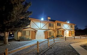 Colorado Springs apartment for rent - A house with lights on at night.