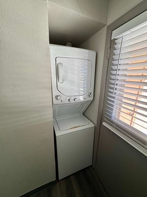 Colorado Springs apartment for rent - A white washing machine is in a small room.