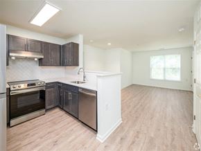 Silver Spring apartment for rent - A kitchen with a stove top oven and a dishwasher.