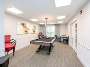 Silver Spring apartment for rent - A room with a pool table and chairs.