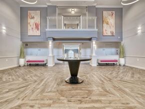 Olney apartment for rent - A spacious room with a wooden floor and a balcony on the second floor.