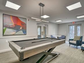 Olney apartment for rent - A room with a pool table and a painting on the wall.