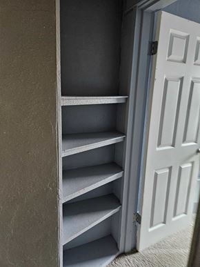 Everett house for rent - A white door is open to a set of grey shelves.