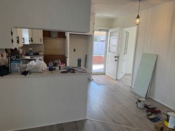 Mount Airy house for rent - A kitchen with white cabinets and a white counter top.