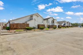 Beaumont apartment for rent - A row of houses with a clear blue sky above them.