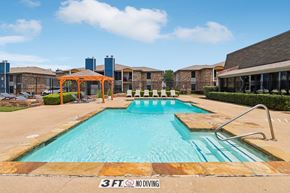 Fort Worth apartment for rent - A 3ft diving board is in the middle of a swimming pool.