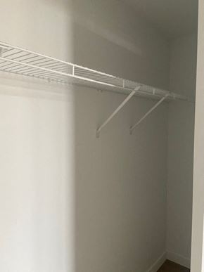 Saint-Laurent apartment for rent - A white shelf is mounted on a white wall.