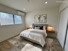 Torrance apartment for rent - A bedroom with a large bed and two lamps.