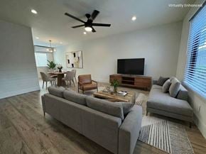 Torrance apartment for rent - A living room with a grey couch, a coffee table, and a television.