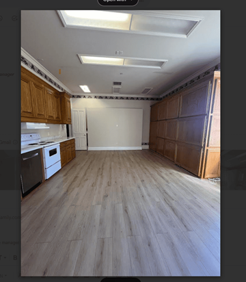 Concord apartment for rent - A kitchen with wooden cabinets and a white dishwasher.