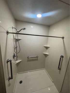 Rothschild house for rent - A white bathroom with a walk in shower.