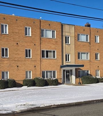 Cleveland Heights apartment for rent - A red brick building with a white door and windows.