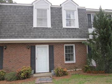 Wilson apartment for rent - A house with a white door and two windows.