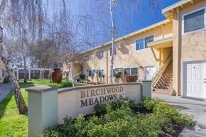 Sacramento apartment for rent - A sign that says Birchwood Meadows in front of a building.