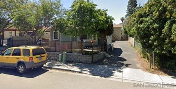 Escondido apartment for rent - A yellow car is parked on the side of a street.