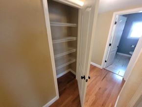 Lebanon house for rent - A white pantry door is open to a hallway.