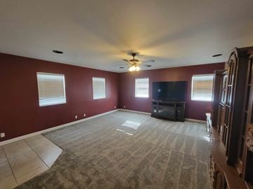 Lebanon house for rent - A living room with a television and a fireplace.