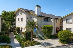 El Cajon apartment for rent - A building with a green staircase in front of it.