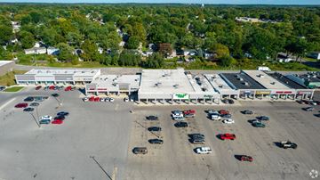 Westerville apartment for rent - An aerial view of a parking lot with cars and a building in the background.