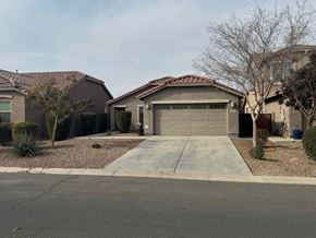 San Tan Valley house for rent - A residential house with a driveway and a garage.