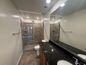 San Tan Valley house for rent - A bathroom with a toilet, sink, and shower.