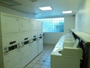 N. Hollywood apartment for rent - A row of washing machines in a laundromat.