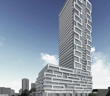 Toronto apartment for rent - A modern skyscraper with a striped facade stands tall against a blue sky.